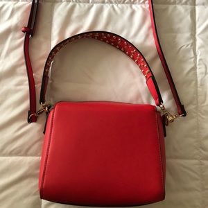 Red shoulder bag with gold studs